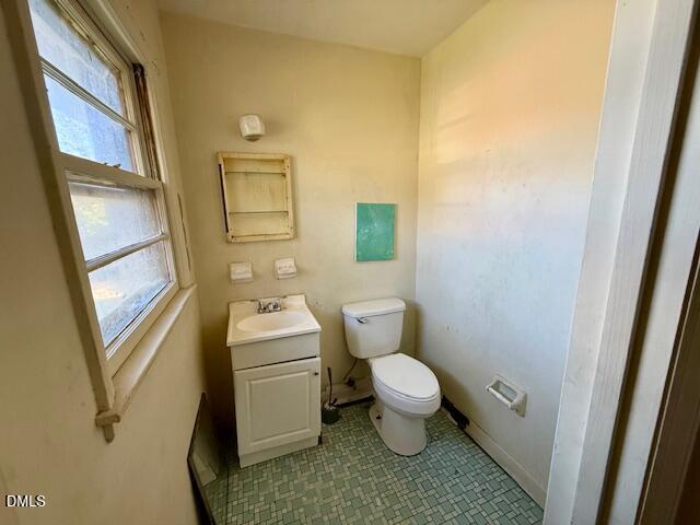133 Hill Street Roxboro, NC 27573 - Photo 13 of 15 a bathroom with a sink toilet and window
