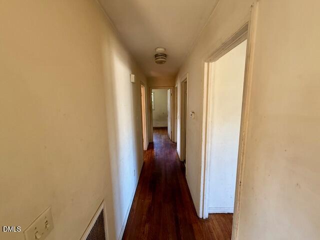 133 Hill Street Roxboro, NC 27573 - Photo 7 of 15 a view of a hallway with wooden floor and a bathroom