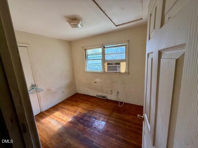 133 Hill Street Roxboro, NC 27573 - Photo 10 of 15 an empty room with wooden floor and windows