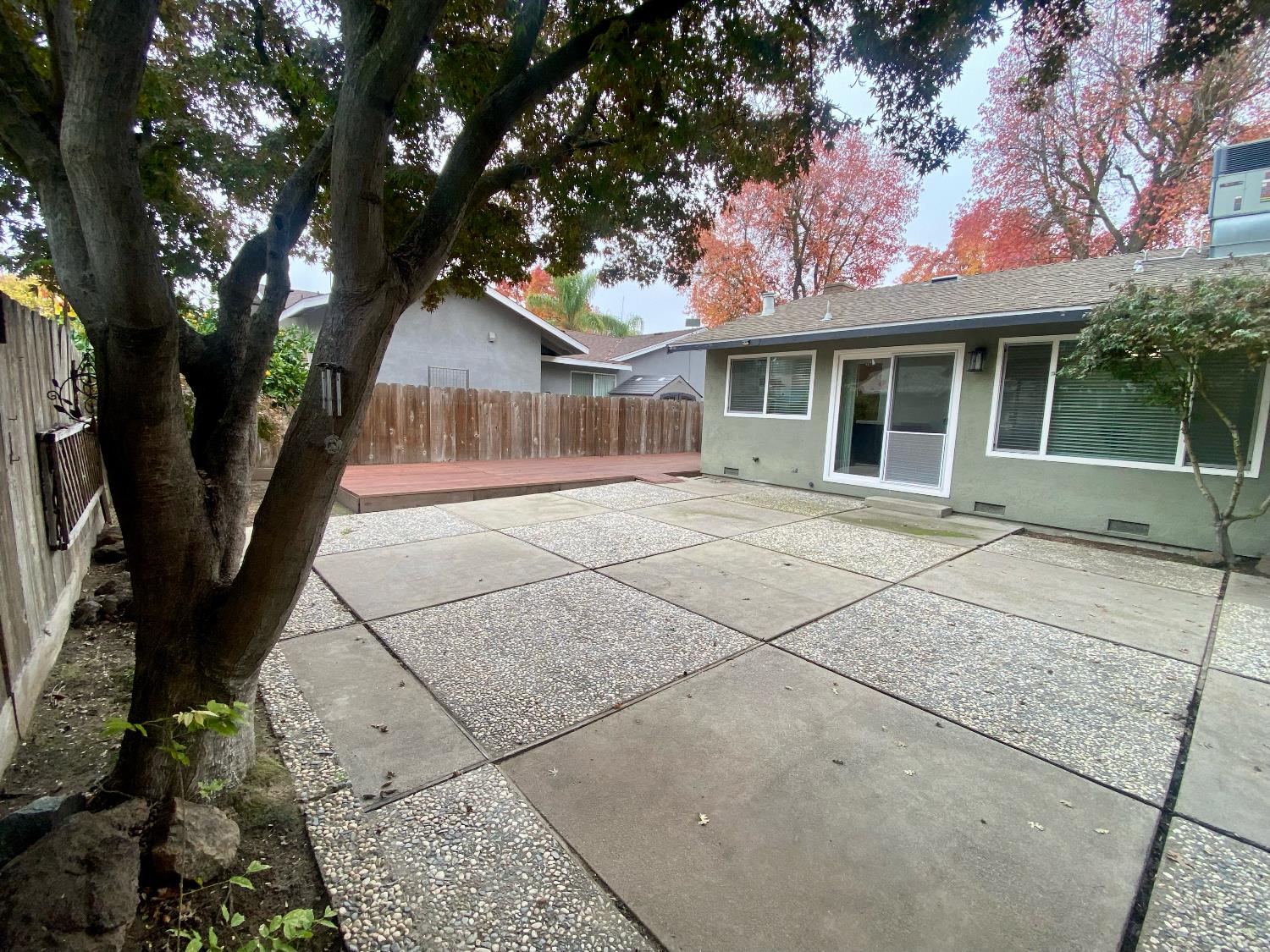 2301 McRitchie Way Modesto, CA 95355 - Photo 21 of 22 front view of a house with a tree