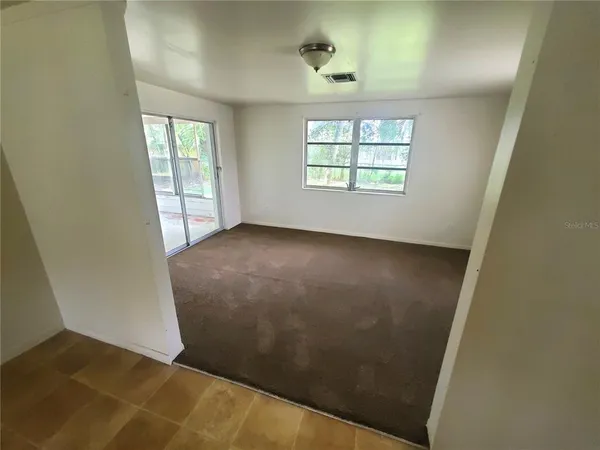 an empty room with windows