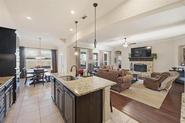 a living room with fireplace furniture and a flat screen tv