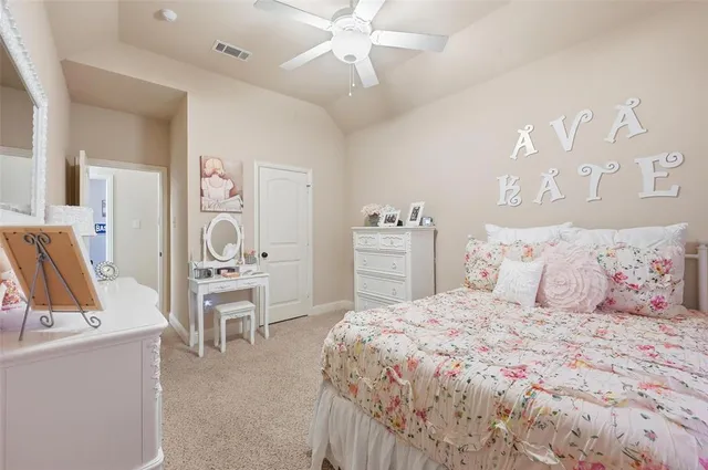 a bedroom with a bed and a table