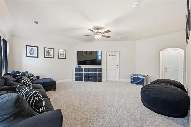 a bedroom with furniture and a chandelier