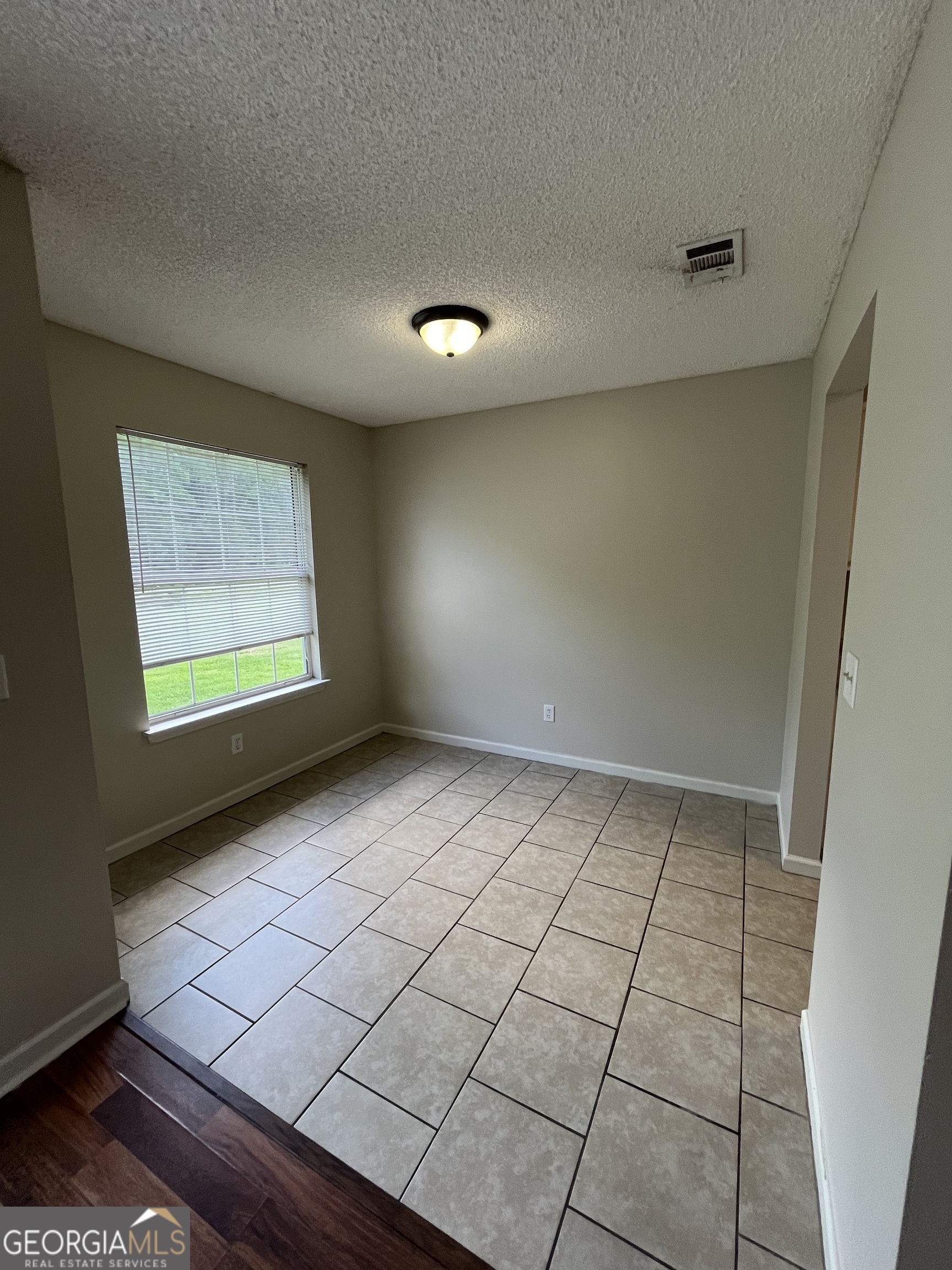 15 Talbot Court St. Marys, GA 31558 - Photo 11 of 20 a view of an empty room and window