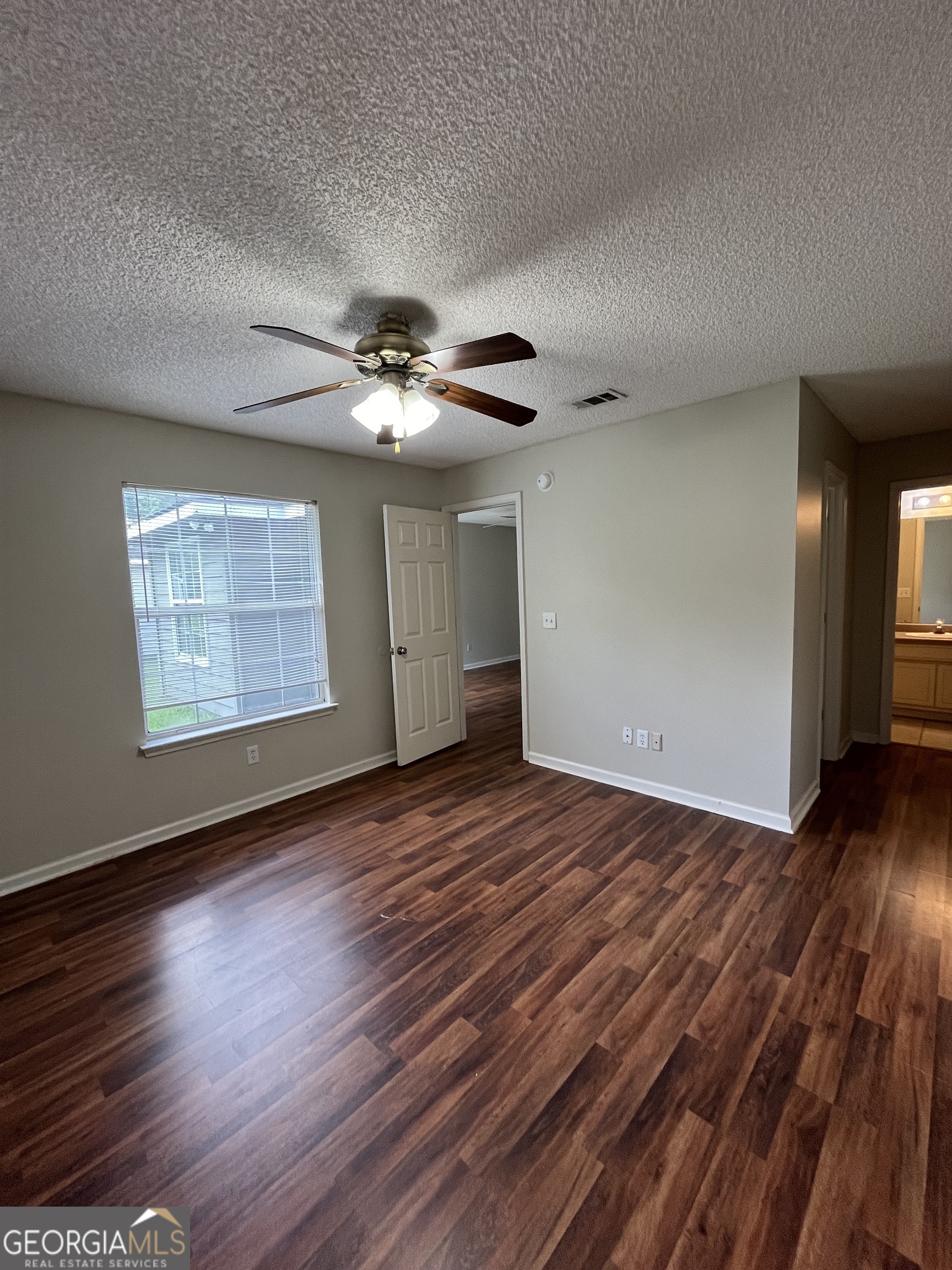 15 Talbot Court St. Marys, GA 31558 - Photo 17 of 20 a view of an empty room with wooden floor and a window