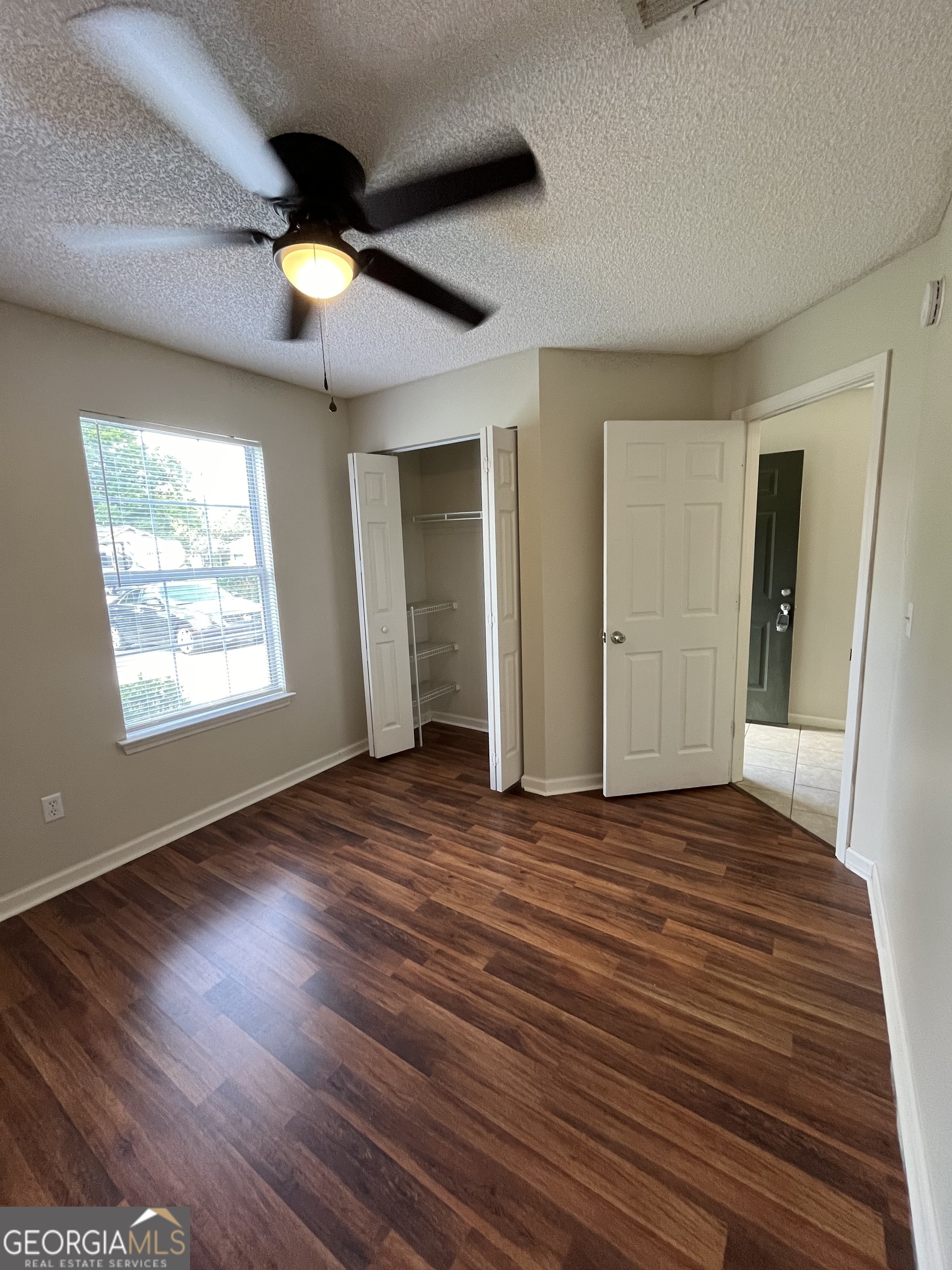 15 Talbot Court St. Marys, GA 31558 - Photo 4 of 20 an empty room with wooden floor closet and windows