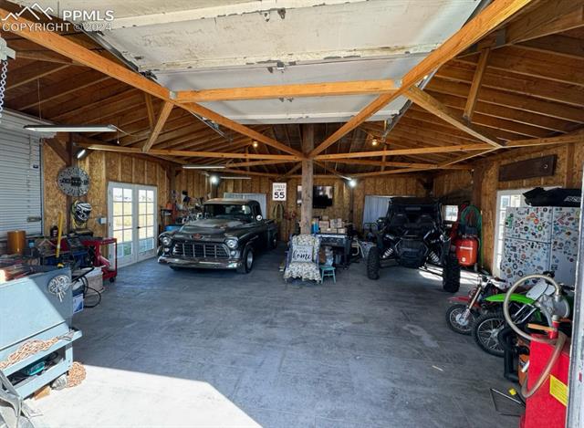 6745 Rio Road Peyton, CO 80831 - Photo 2 of 4 Garage with wooden walls