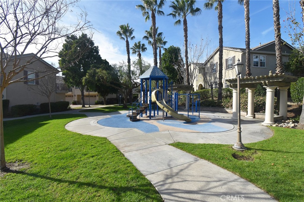 7353 Ellena West, Unit 70 Rancho Cucamonga, CA 91730 - Photo 36 of 40 a view of a park with swings and slides