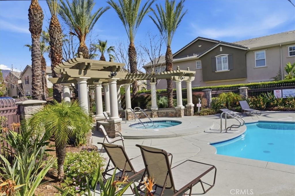 7353 Ellena West, Unit 70 Rancho Cucamonga, CA 91730 - Photo 38 of 40 a view of a chairs and table in a patio