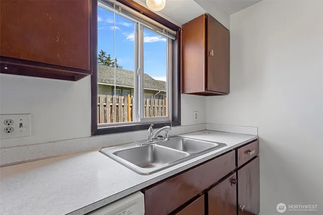 a stove top oven sitting inside of a kitchen