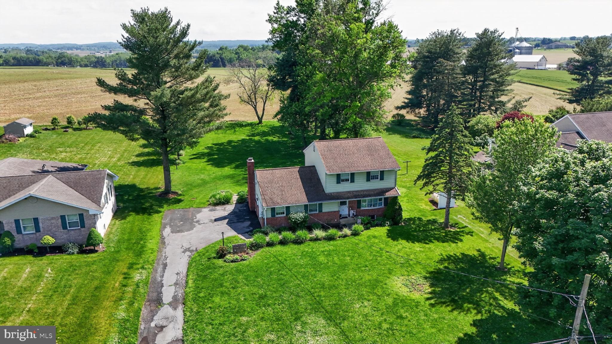 1106 Village Road Lancaster, PA 17602 - Photo 7 of 42 Charming home amidst lush greenery.