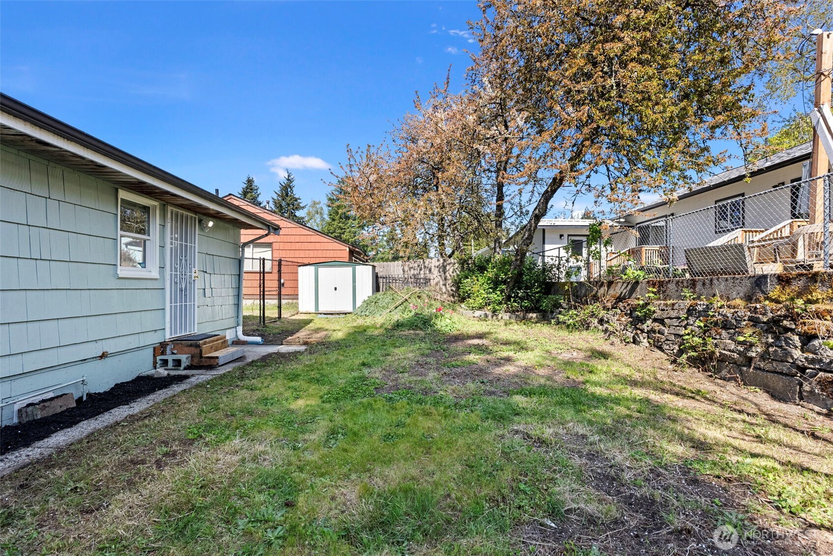 414 Plum Street Bremerton, WA 98310 - Photo 18 of 40 a view of a house with a yard
