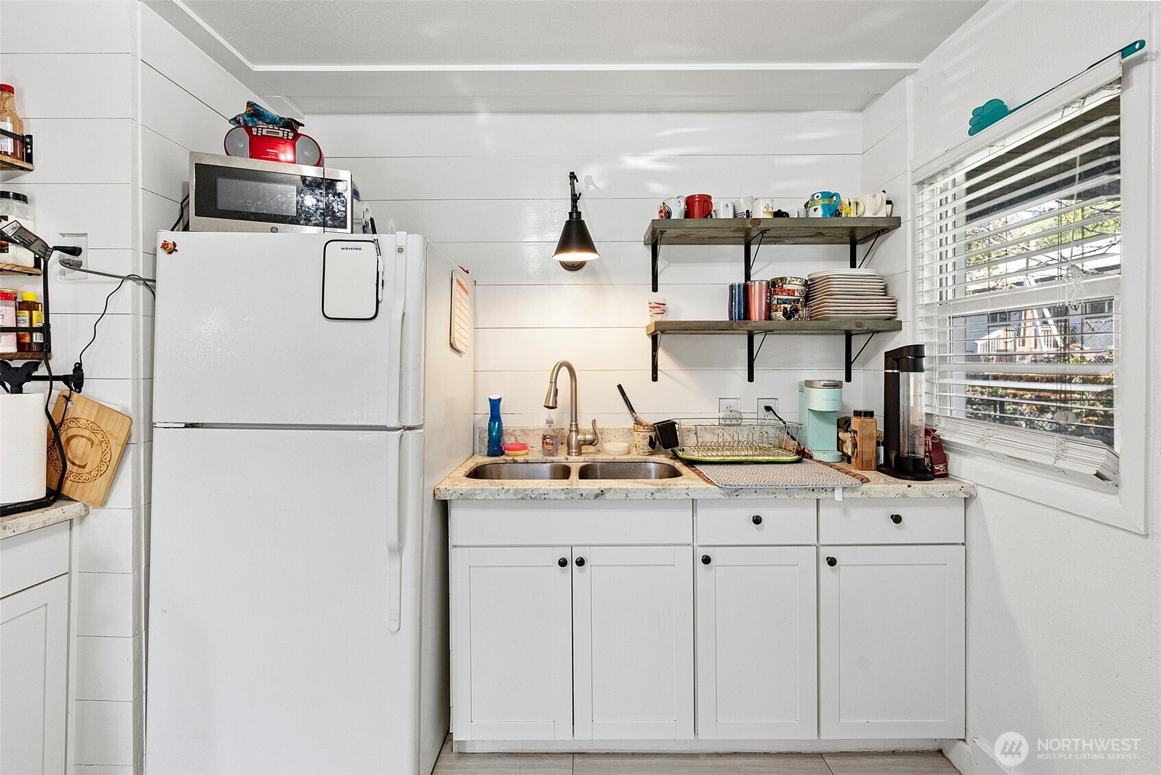 414 Plum Street Bremerton, WA 98310 - Photo 24 of 40 a bathroom with a sink and a refrigerator