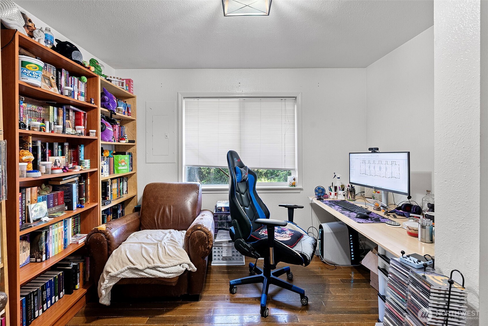 414 Plum Street Bremerton, WA 98310 - Photo 27 of 40 a view of a workspace with furniture and a bookshelf