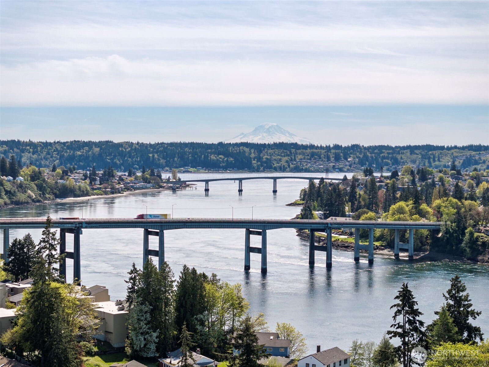 414 Plum Street Bremerton, WA 98310 - Photo 40 of 40 a view of swimming pool with outdoor seating and lake in the back