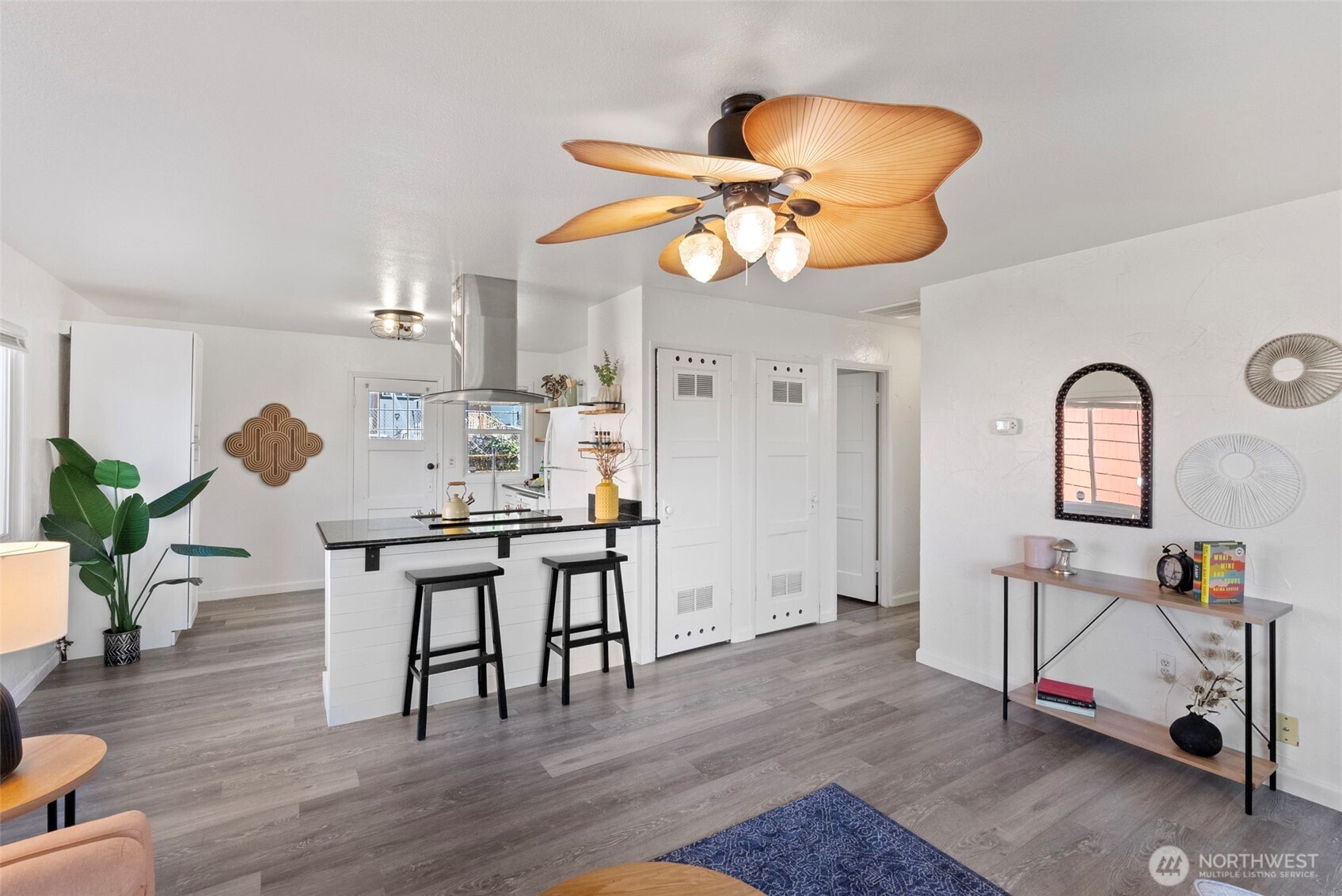 414 Plum Street Bremerton, WA 98310 - Photo 5 of 40 a view of a dining room with furniture and wooden floor