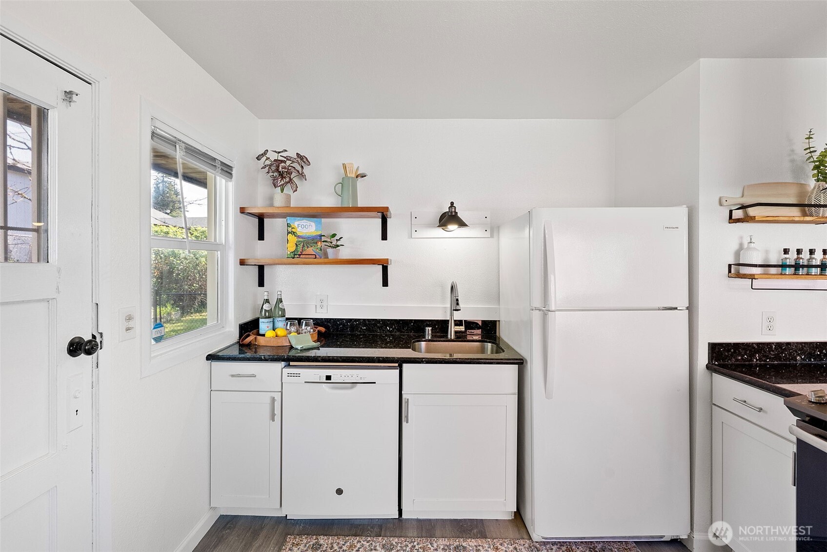 414 Plum Street Bremerton, WA 98310 - Photo 9 of 40 a room with a refrigerator and a stove top oven