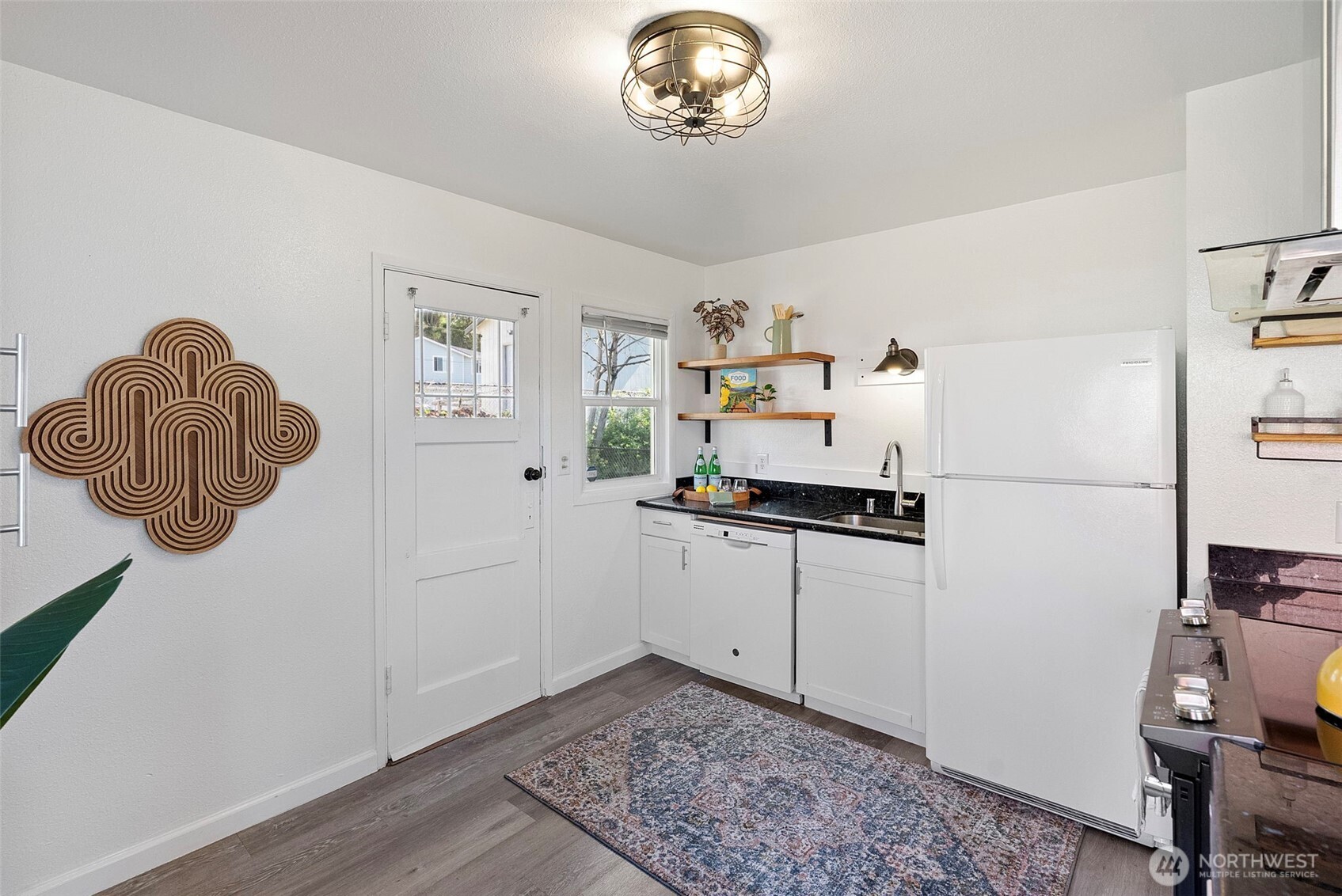 414 Plum Street Bremerton, WA 98310 - Photo 10 of 40 a kitchen with stainless steel appliances granite countertop a sink and a stove