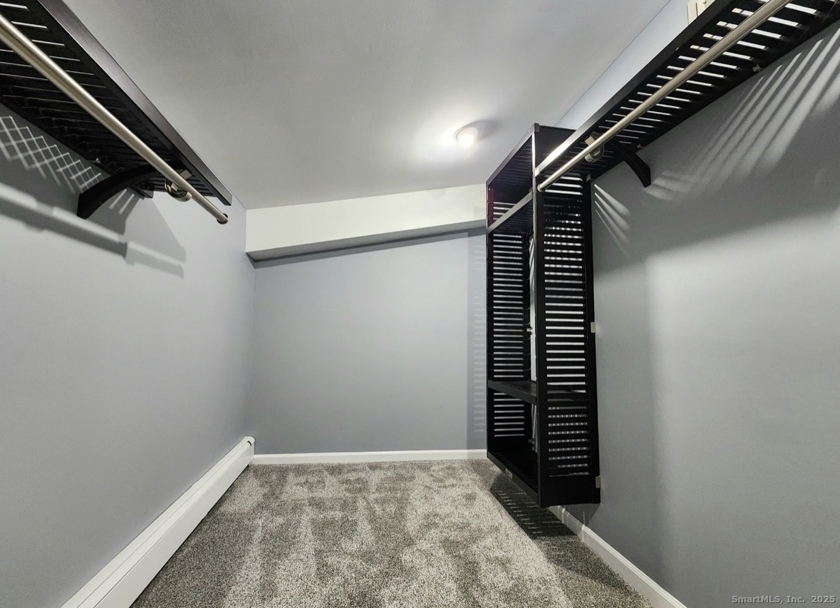 4994 Madison Avenue Trumbull, CT 06611 - Photo 11 of 22 Large walkin closest with custom built in shelves