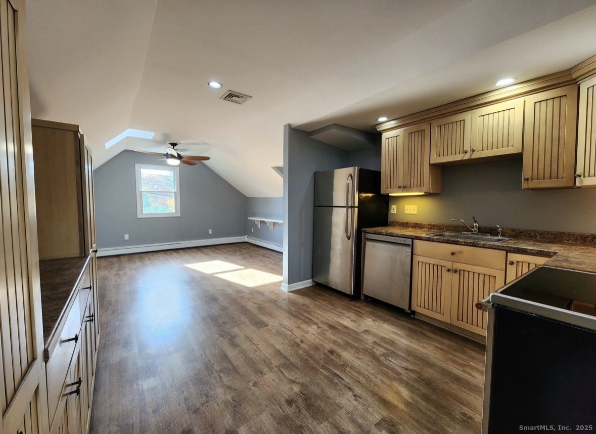 4994 Madison Avenue Trumbull, CT 06611 - Photo 6 of 22 Open, sunlit kitchen-living room