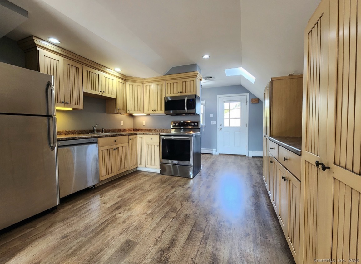 4994 Madison Avenue Trumbull, CT 06611 - Photo 7 of 22 Bright, airy, sunlit kitchen