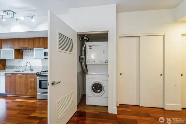 a kitchen with a refrigerator and sink