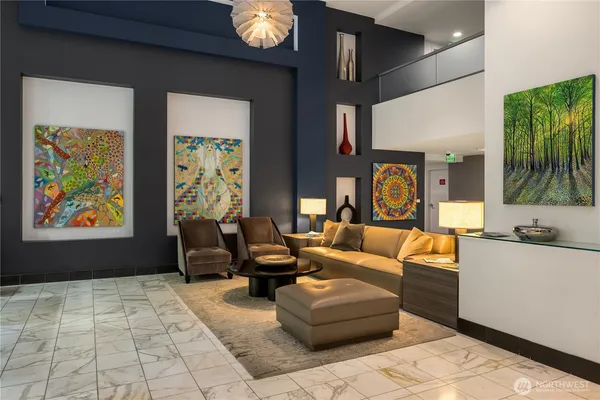 a living room with furniture and a large window
