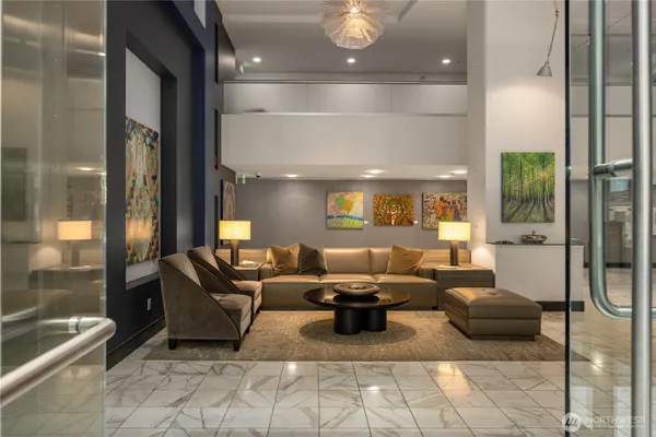 a living room with furniture and a potted plant