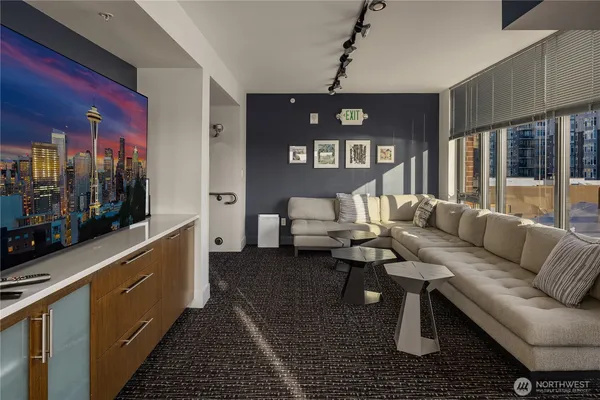 a living room with furniture and a flat screen tv