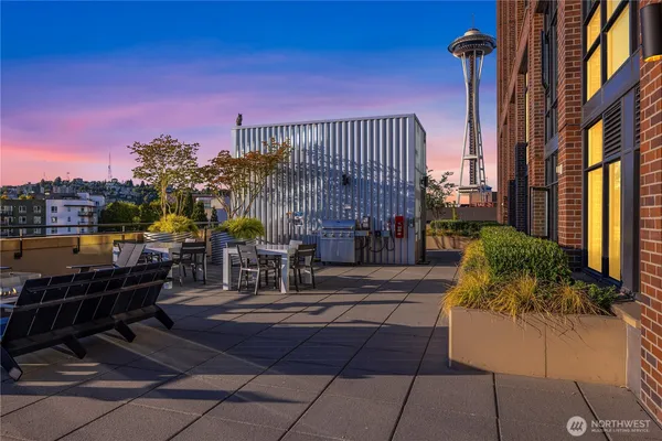 a view of a patio with dining table and chairs with a fire pit