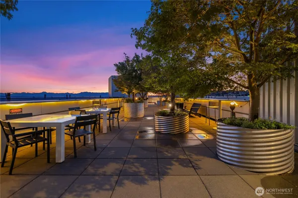 a view of a chairs and table on the patio