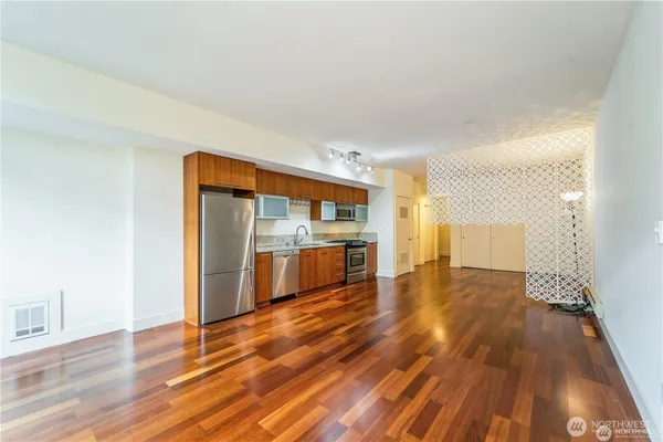 a view of a kitchen with wooden floor