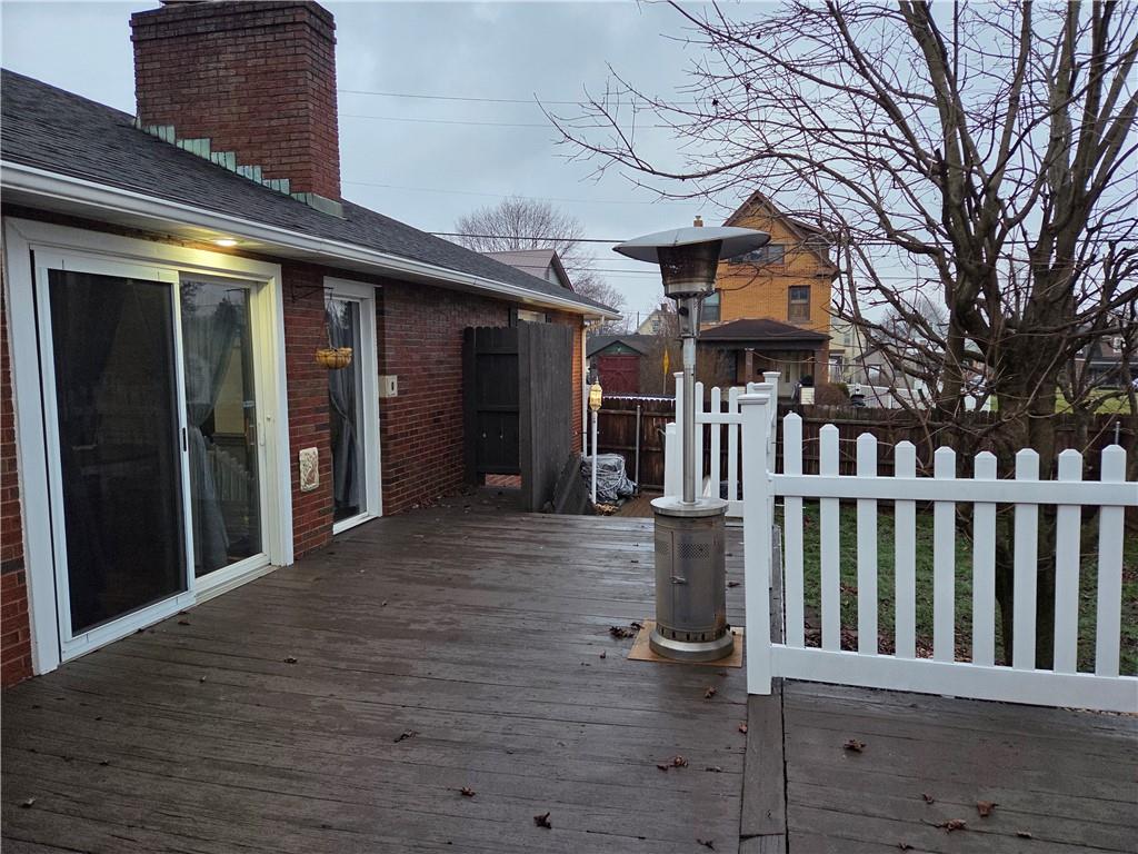 206 8th Avenue Butler, PA 16001 - Photo 16 of 20 a view of a brick house with large windows and a table