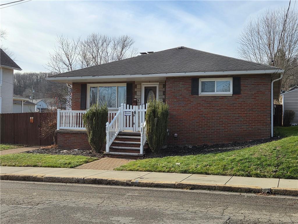 206 8th Avenue Butler, PA 16001 - Photo 2 of 20 a front view of a house with a yard and garage