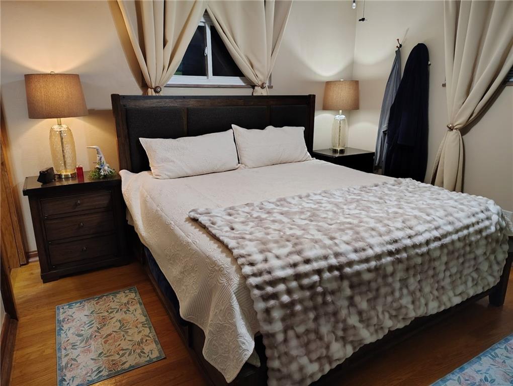 206 8th Avenue Butler, PA 16001 - Photo 8 of 20 a bed sitting in a bedroom and lamp