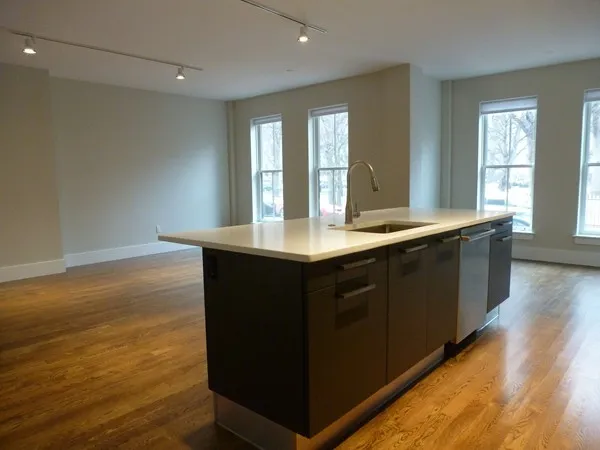 a kitchen with a sink and a window