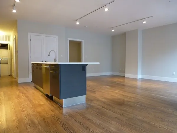 a view of kitchen with wooden floor