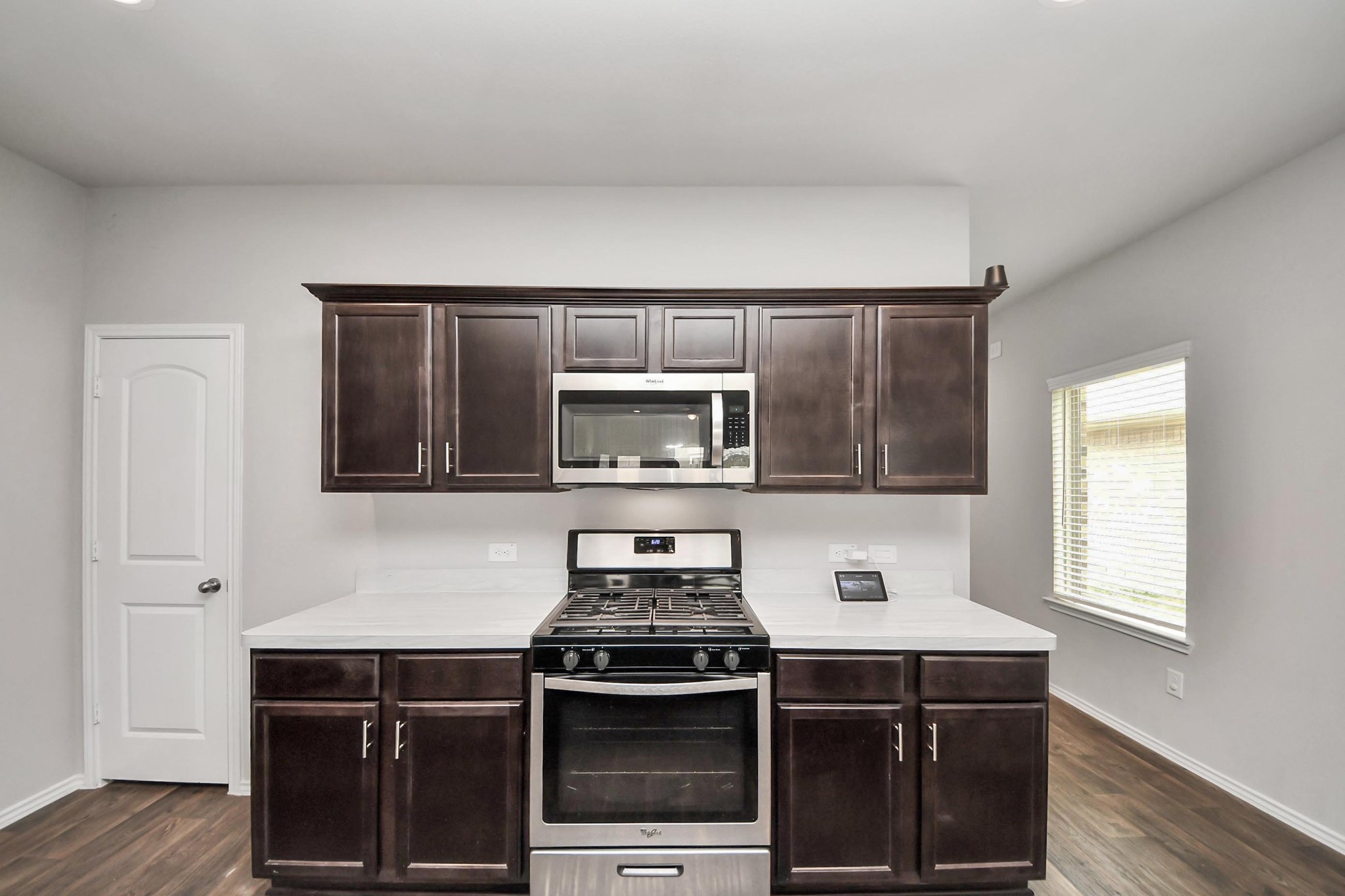 2347 Pettingell Way Spring Spring, TX 77373 - Photo 13 of 41 Open kitchen view with large island, stainless steel refrigerator, and airy layout.