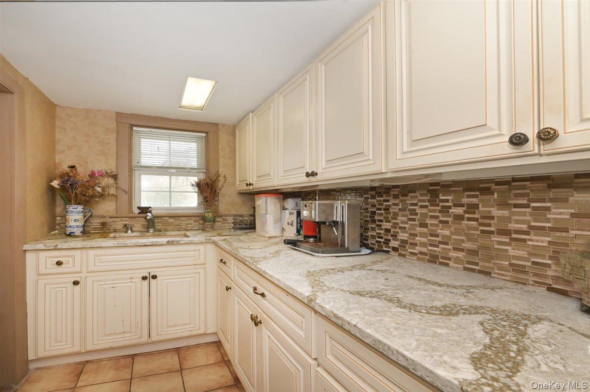 6 Callahan Road Fort Salonga, NY 11768 - Photo 14 of 50 a kitchen with white cabinets and sink