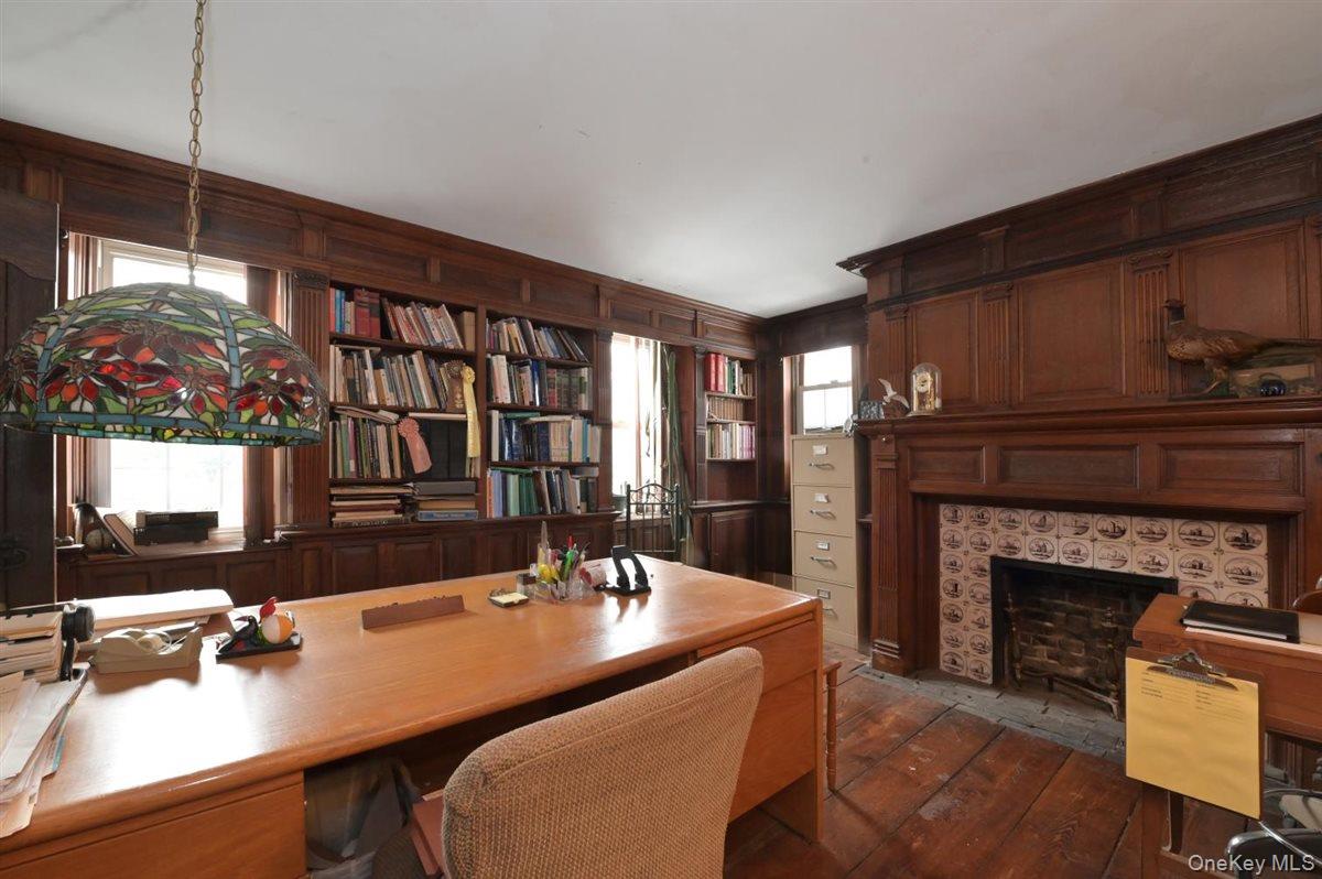 6 Callahan Road Fort Salonga, NY 11768 - Photo 16 of 50 a dining room with a table chairs and a fireplace