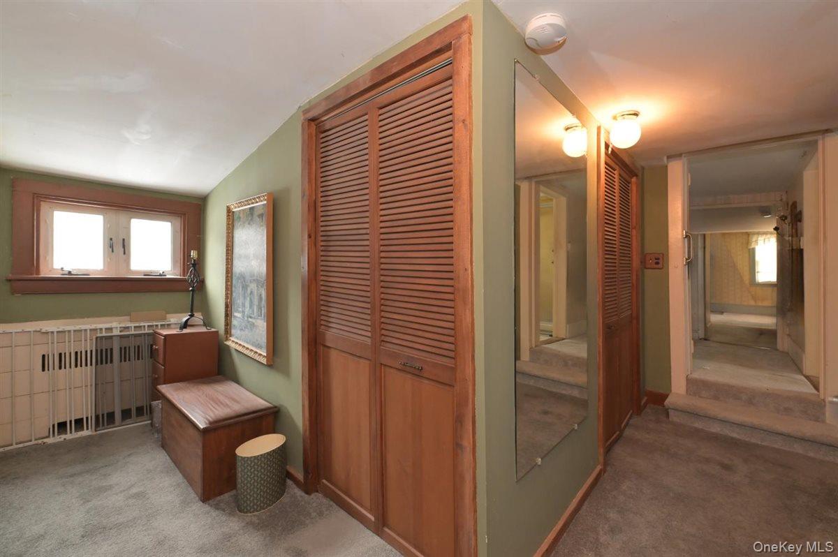 6 Callahan Road Fort Salonga, NY 11768 - Photo 21 of 50 a bathroom with a toilet sink and mirror