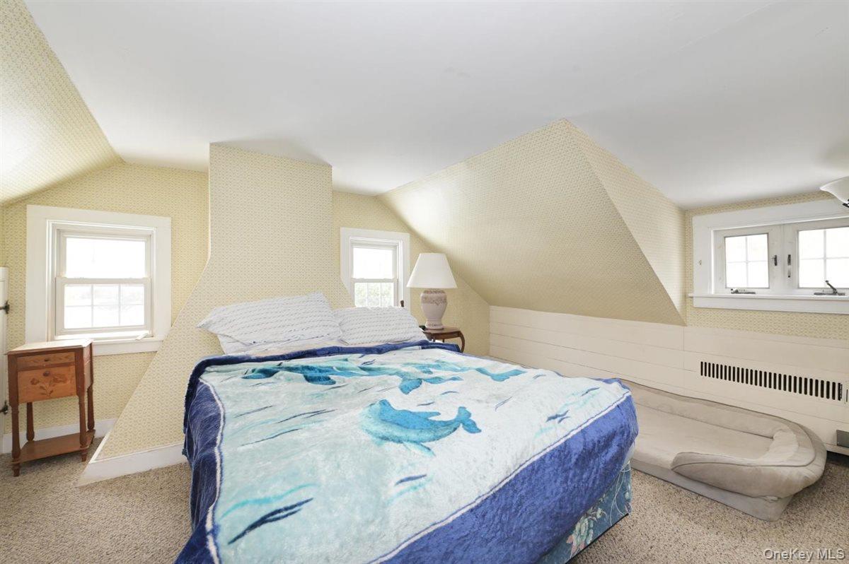 6 Callahan Road Fort Salonga, NY 11768 - Photo 22 of 50 a bedroom with a bed and a couch