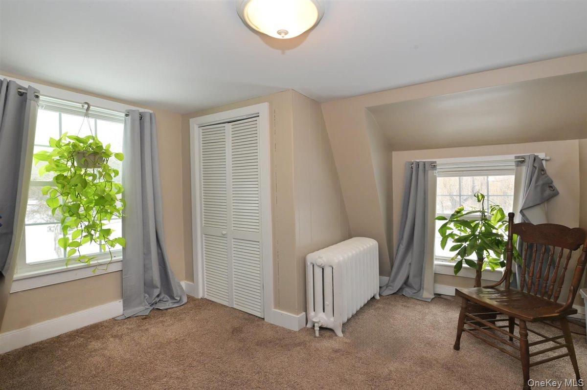 6 Callahan Road Fort Salonga, NY 11768 - Photo 23 of 50 a living room with furniture and a potted plant