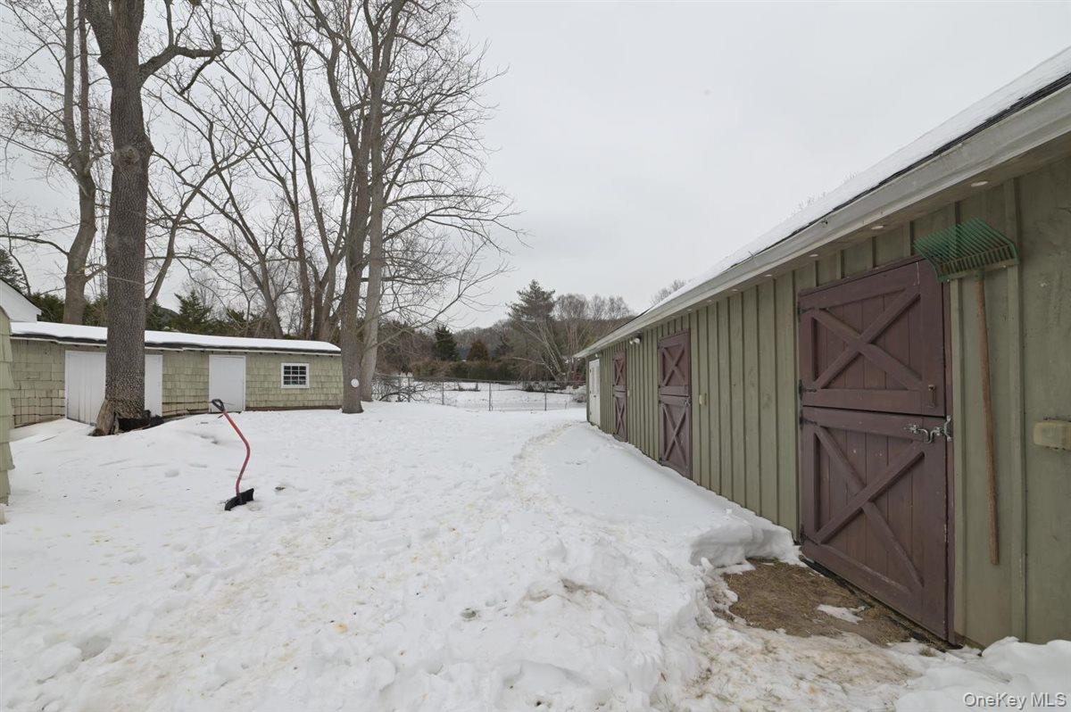 6 Callahan Road Fort Salonga, NY 11768 - Photo 32 of 50 a street view covered with snow in front of house