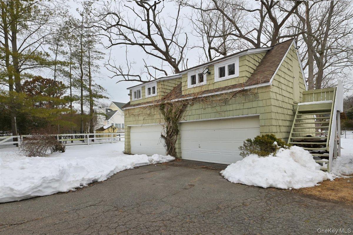 6 Callahan Road Fort Salonga, NY 11768 - Photo 34 of 50 a view of a house with a snow in the yard