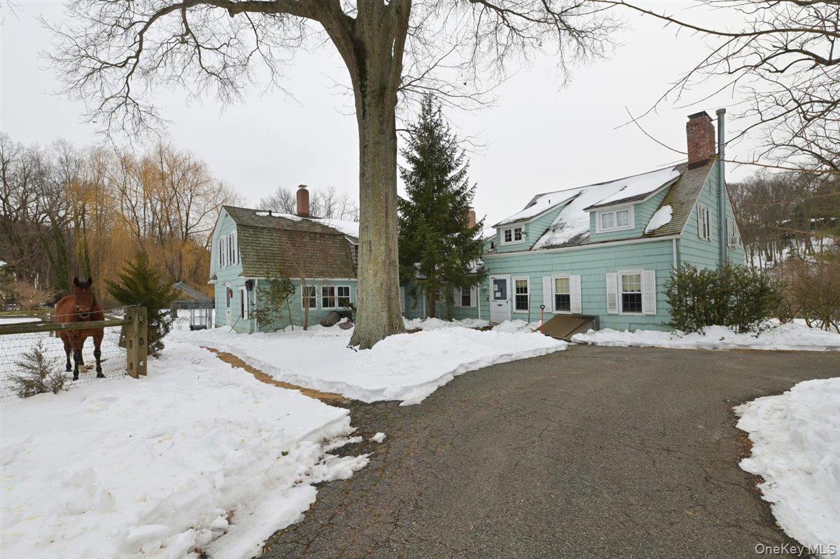 6 Callahan Road Fort Salonga, NY 11768 - Photo 4 of 50 a view of a house with snow on the road