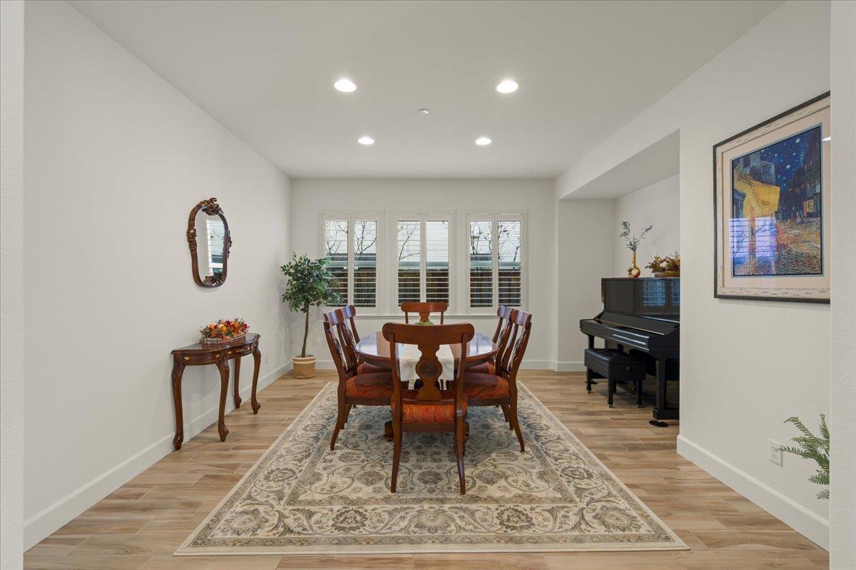 1188 Viognier Way Gilroy, CA 95020 - Photo 12 of 71 a dining room with furniture a rug and a rug