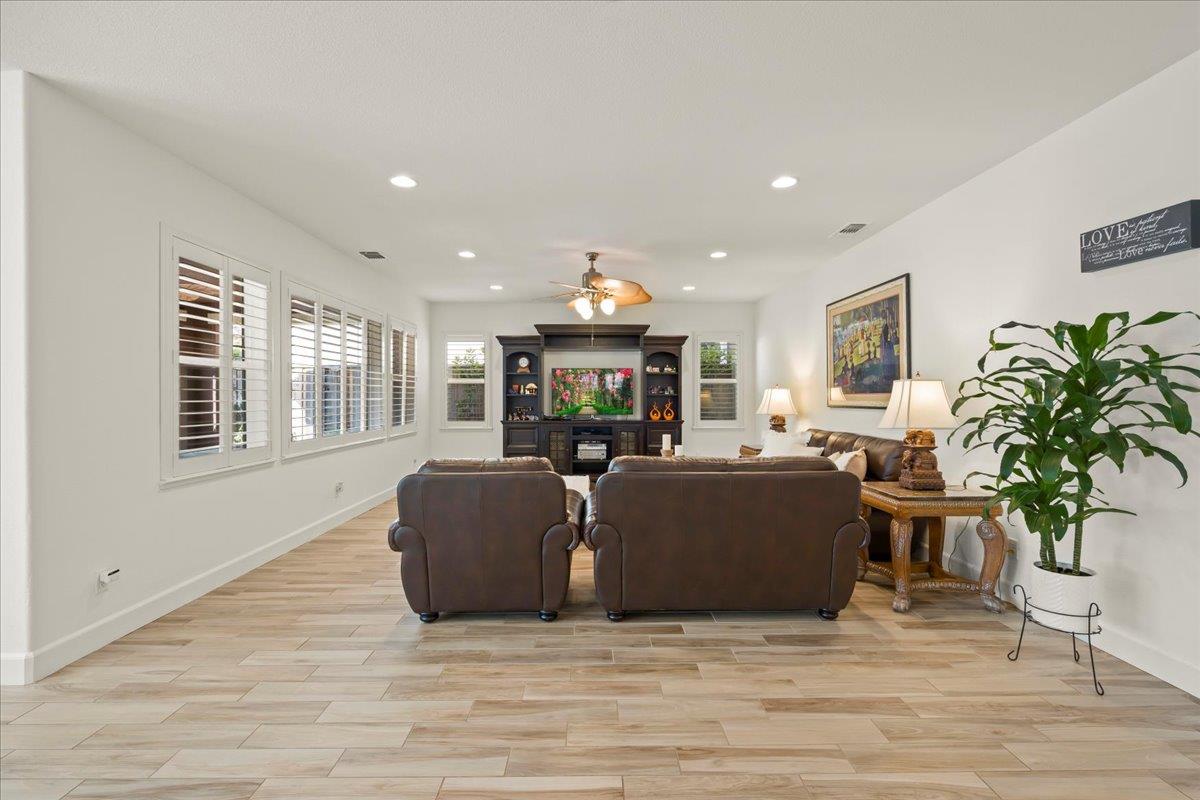 1188 Viognier Way Gilroy, CA 95020 - Photo 14 of 71 a living room with furniture a potted plant and a large window