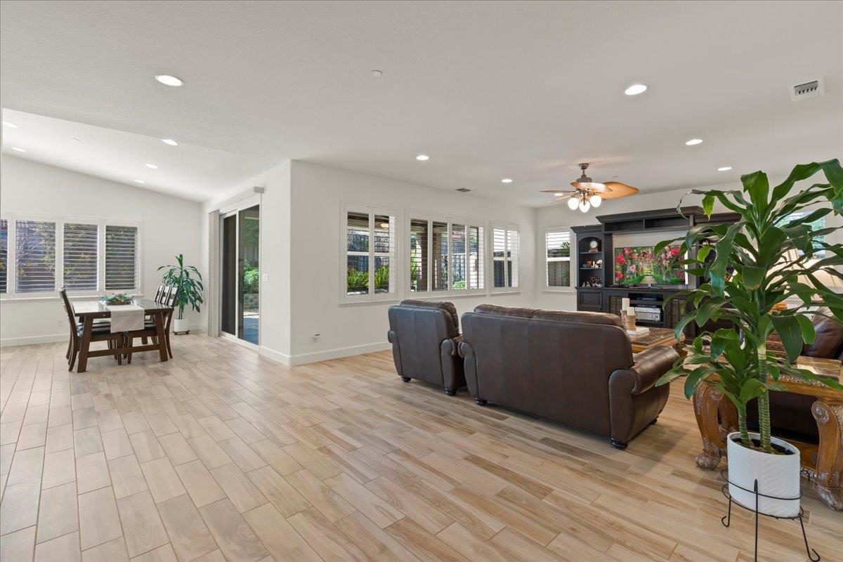1188 Viognier Way Gilroy, CA 95020 - Photo 15 of 71 a living room with furniture and a dining table with wooden floor
